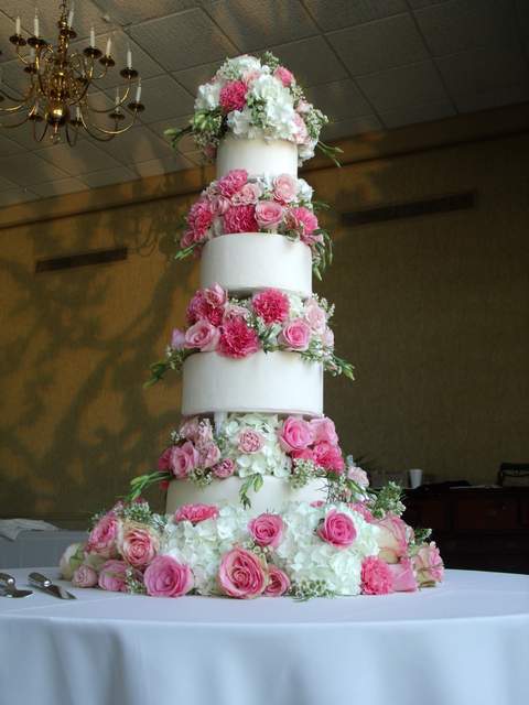 Flower covered wedding cake